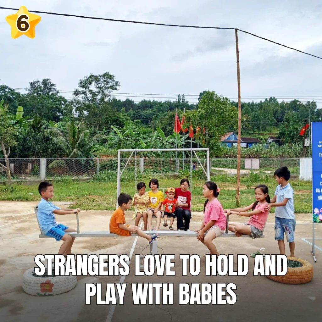 Strangers love to hold and play with babies